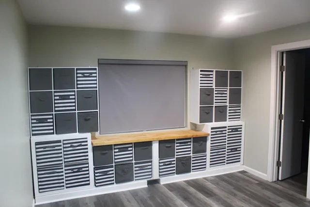 a bathroom with a sink vanity and mirror