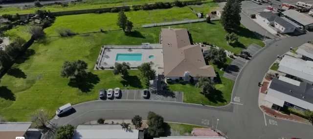 an aerial view of a house with a garden