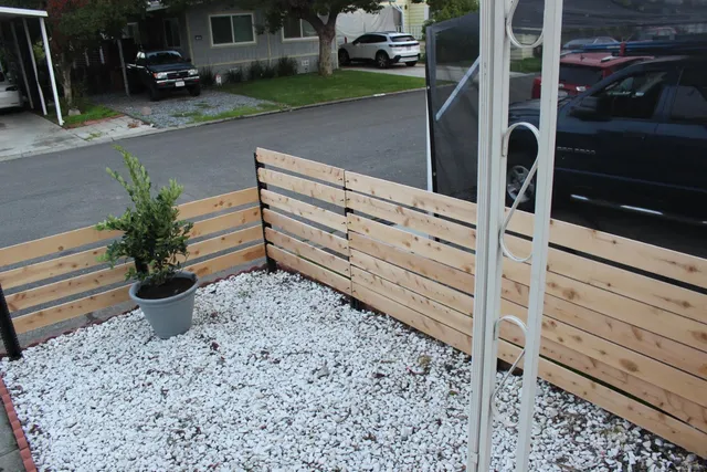 a view of a backyard with sitting area