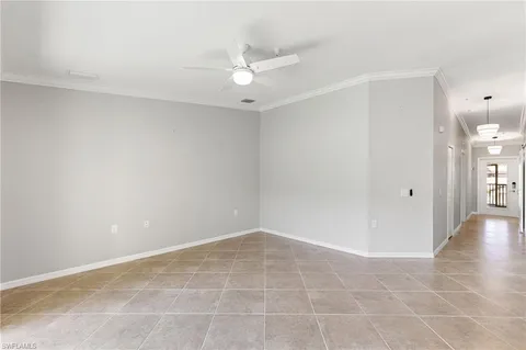 a large kitchen with kitchen island granite countertop a table and chairs in it