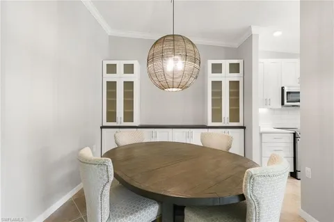 a bedroom with a bed and a lamp