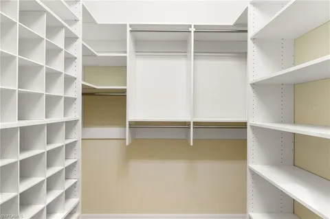 an empty room with a ceiling fan and a ceiling fan