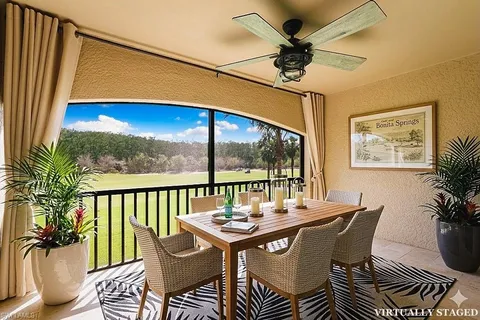 a view of a balcony with a ceiling fan