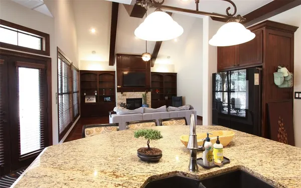 a kitchen with a table and chairs