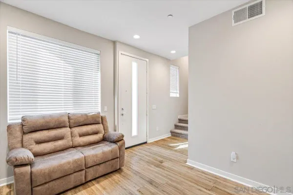 a living room with furniture and a window