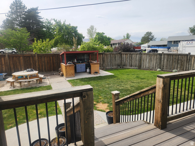 705 North 700 East Payson, UT 84651 - Photo 21 of 30 Wooden deck with a patio area and a fenced backyard