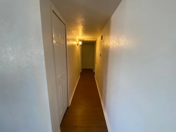 a view of a hallway with a glass door