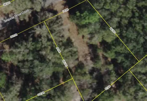 an aerial view of multiple house with outdoor space
