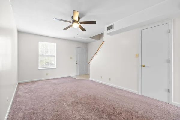 a view of an empty room with a window