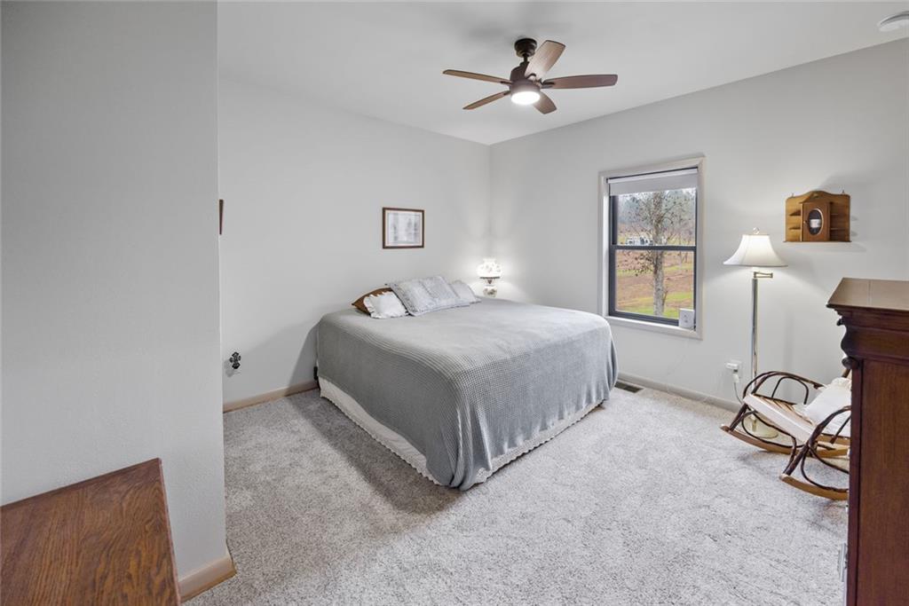 1581 Taylor Town Road Northeast Ranger, GA 30734 - Photo 12 of 37 a bedroom with a bed a desk and chair