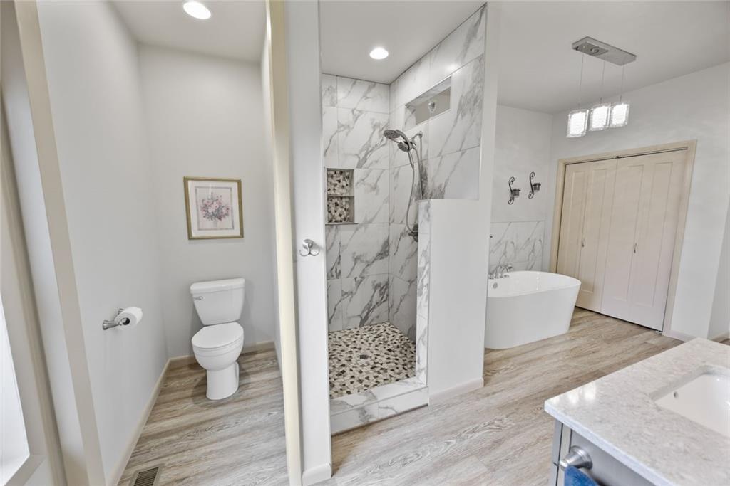 1581 Taylor Town Road Northeast Ranger, GA 30734 - Photo 12 of 30 a bathroom with a sink a toilet and shower