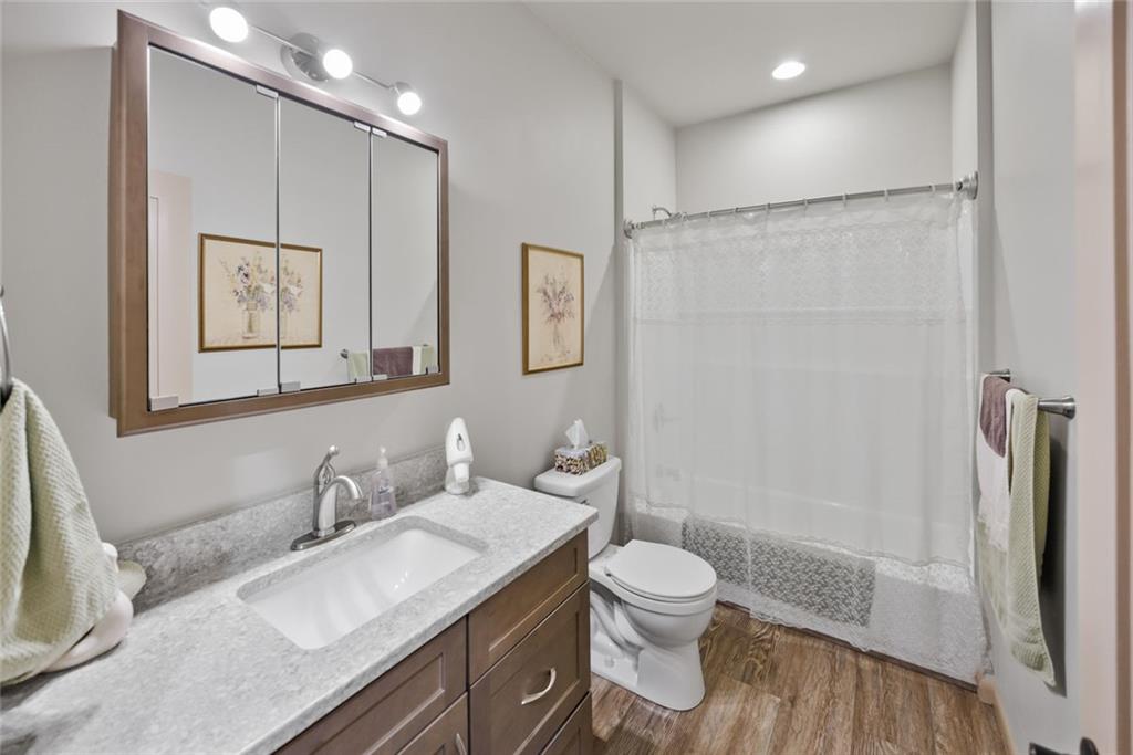 1581 Taylor Town Road Northeast Ranger, GA 30734 - Photo 15 of 30 a bathroom with a granite countertop sink toilet and shower