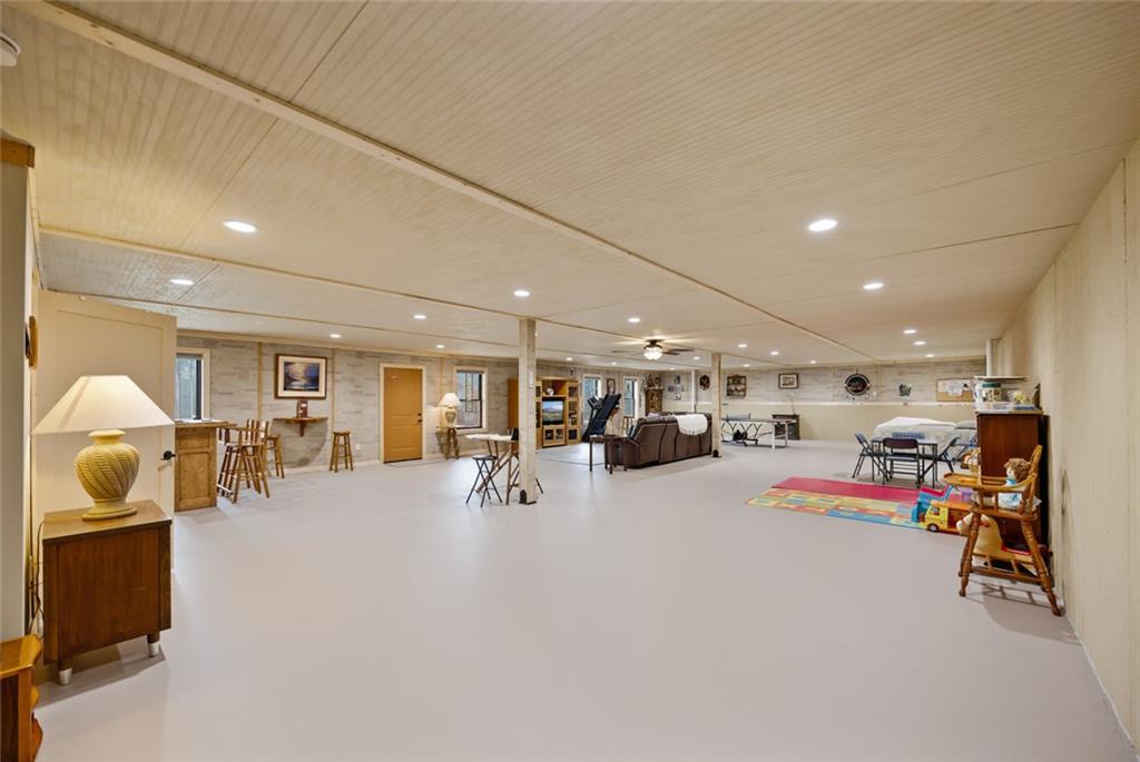 1581 Taylor Town Road Northeast Ranger, GA 30734 - Photo 17 of 30 a room with lots of furniture and cars