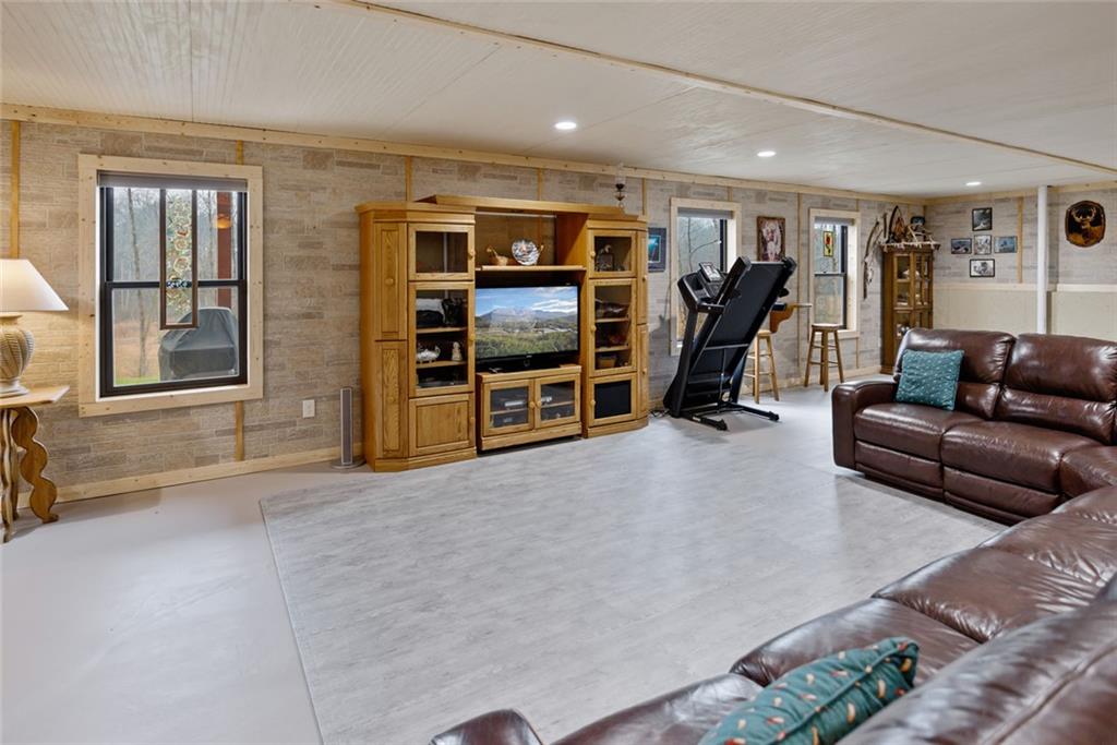 1581 Taylor Town Road Northeast Ranger, GA 30734 - Photo 18 of 30 a view of a livingroom with furniture and a flat screen tv