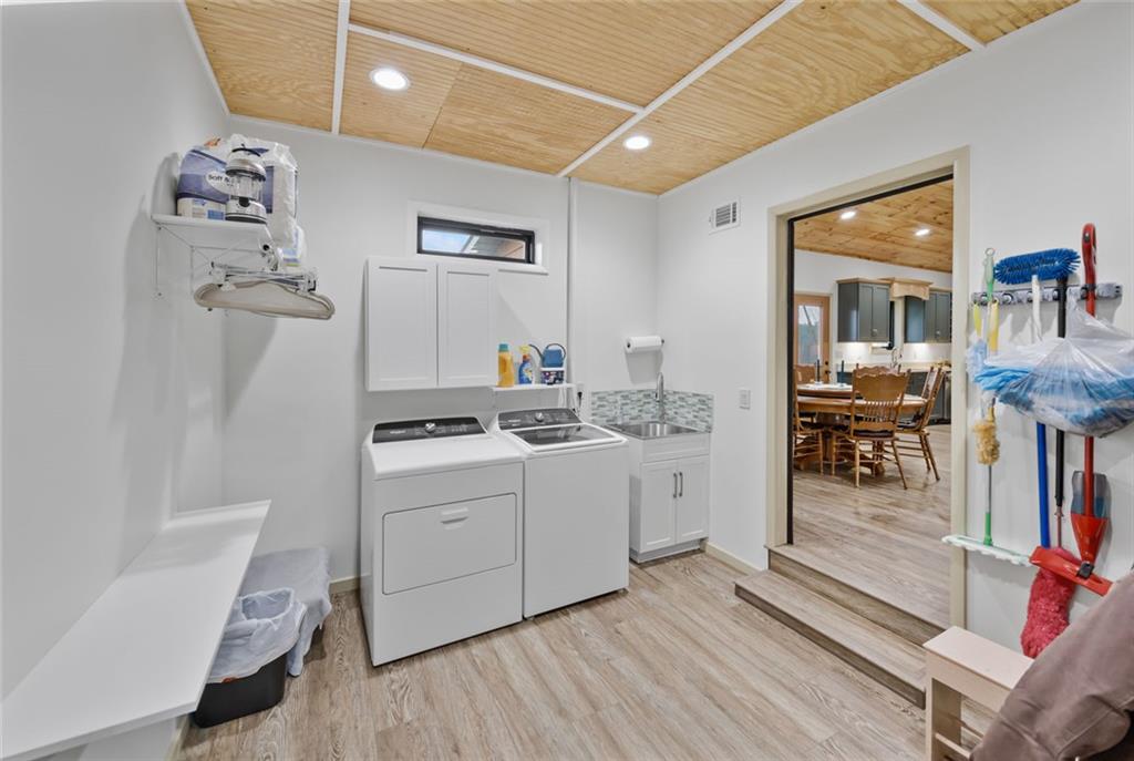 1581 Taylor Town Road Northeast Ranger, GA 30734 - Photo 23 of 37 a room with a washing machine and sink
