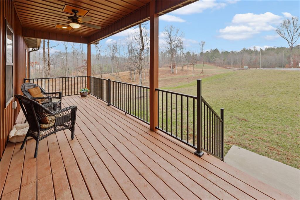 1581 Taylor Town Road Northeast Ranger, GA 30734 - Photo 3 of 30 a view of a balcony with wooden floor next to a lake