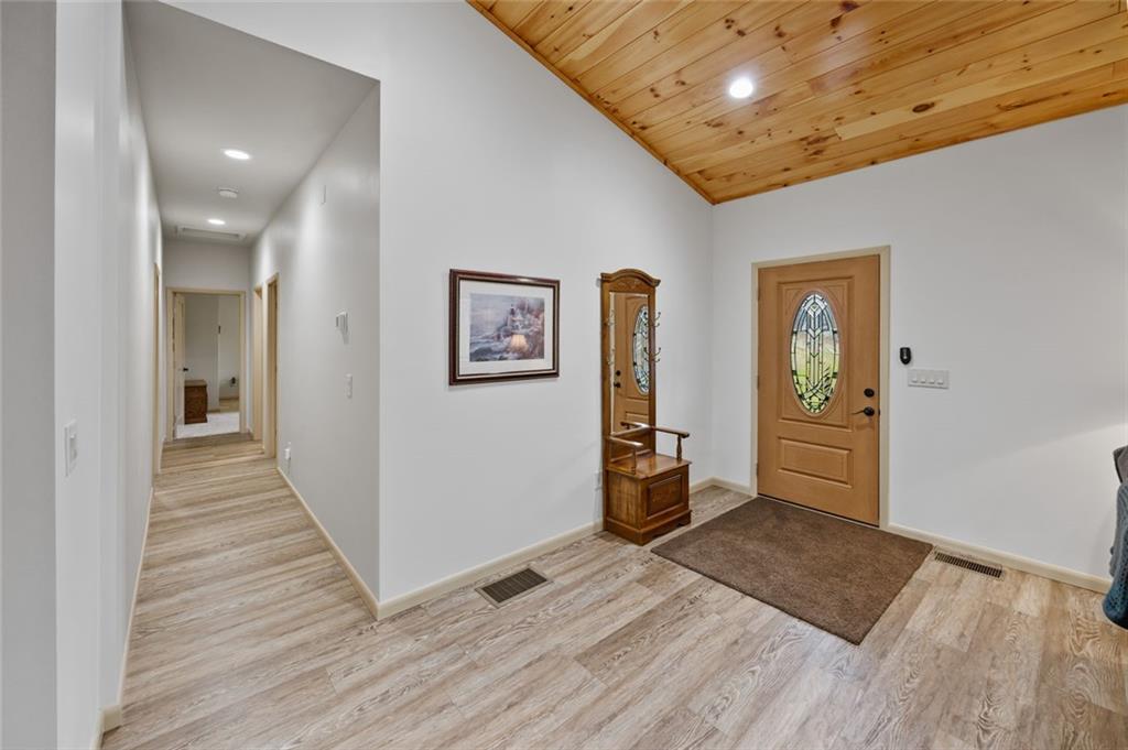 1581 Taylor Town Road Northeast Ranger, GA 30734 - Photo 8 of 30 a view of a hallway with wooden floor and a bathroom