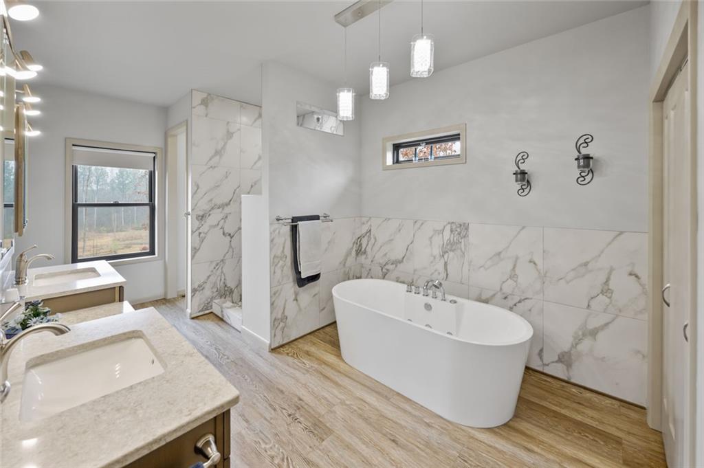 1581 Taylor Town Road Northeast Ranger, GA 30734 - Photo 10 of 30 a spacious bathroom with a sink and a mirror