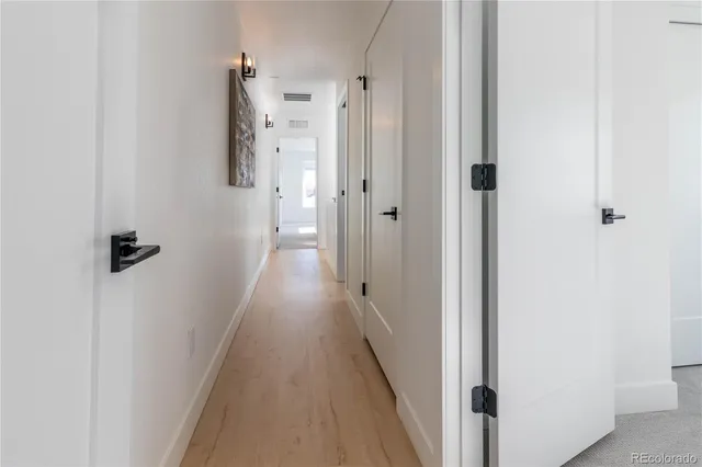 a view of a terrace with a table and chairs