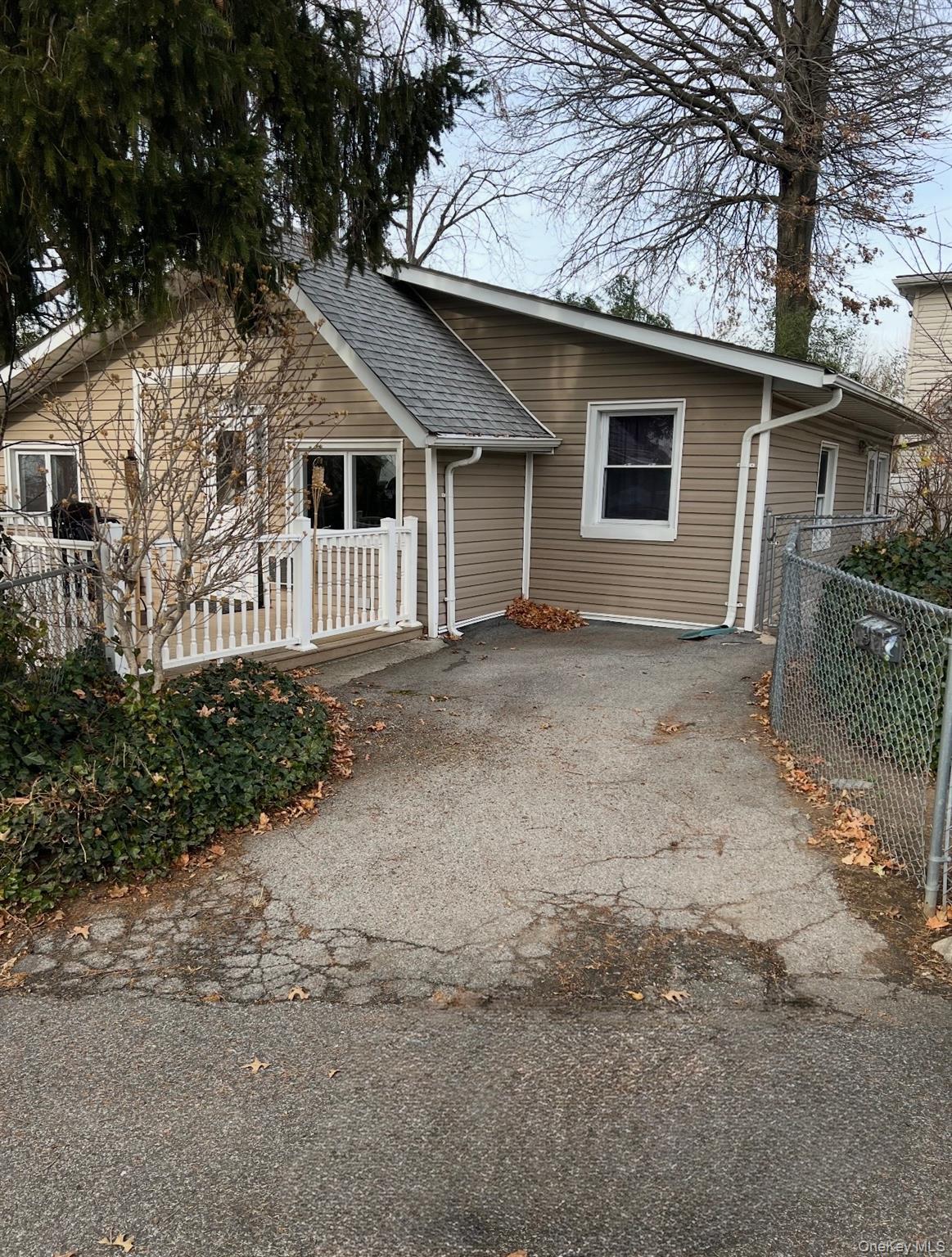 1015 Harding Park Bronx, NY 10473 - Photo 2 of 13 a front view of a house with a yard