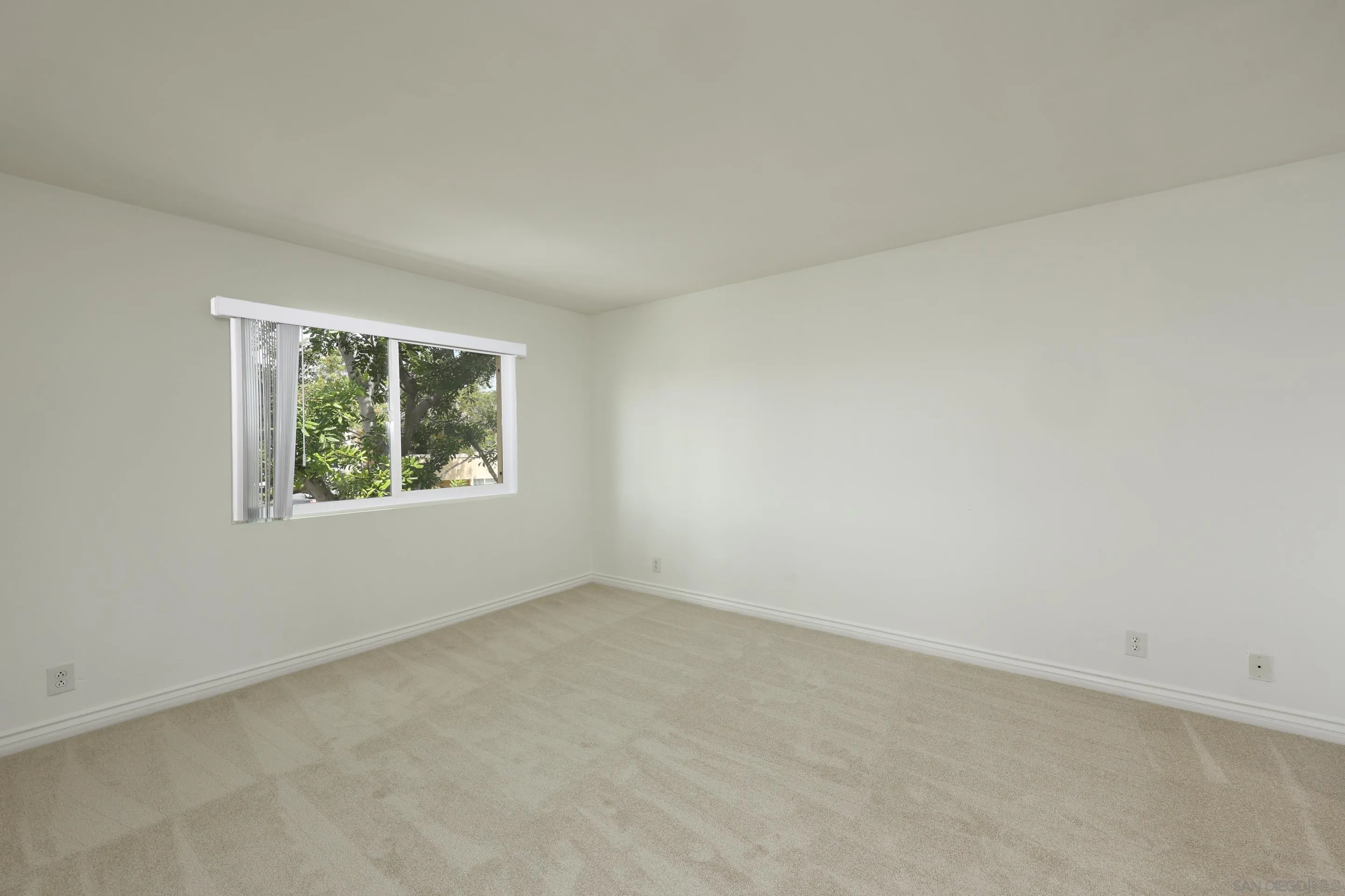 9949 Erma Road, Unit 203 San Diego, CA 92131 - Photo 22 of 43 an empty room with windows