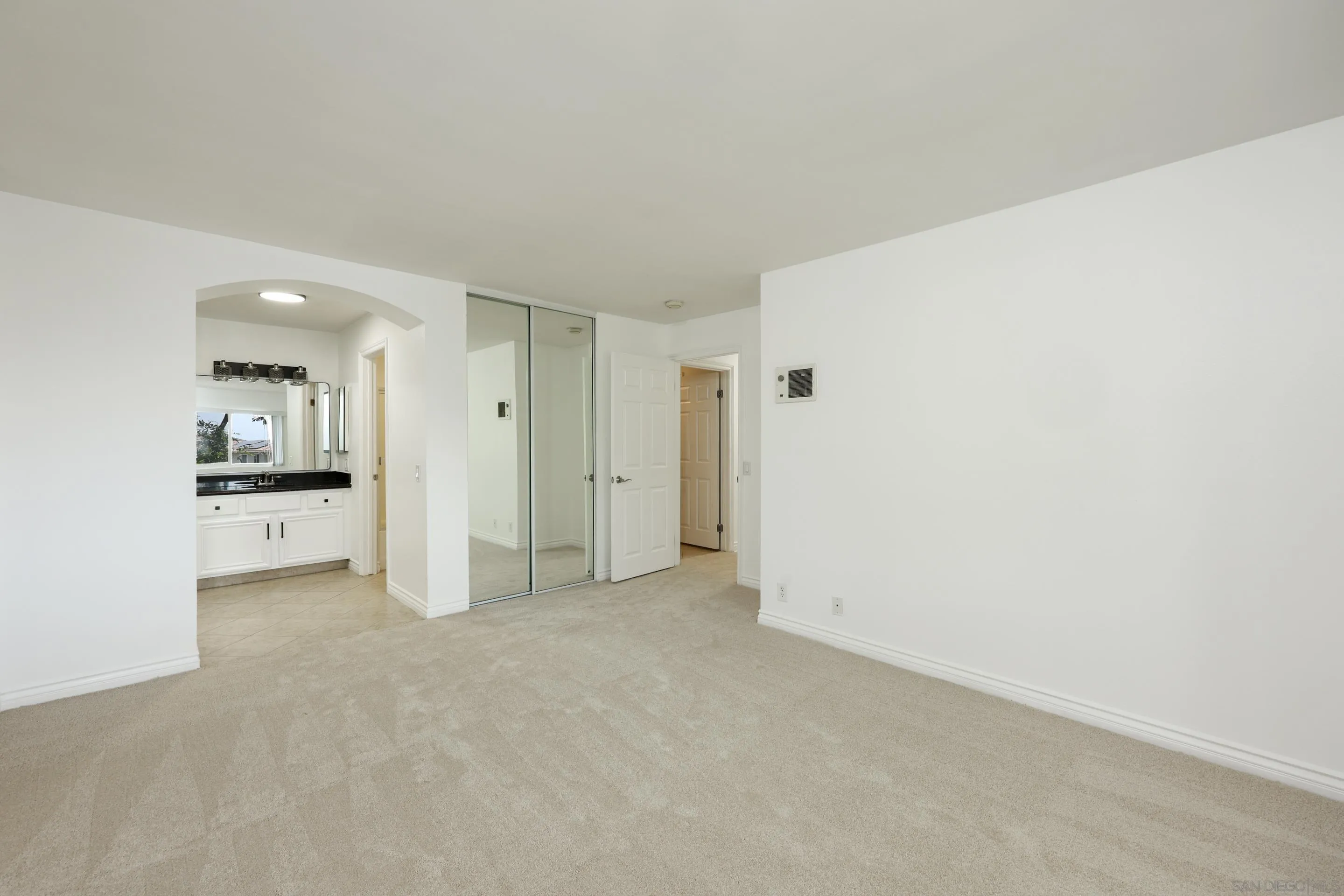 9949 Erma Road, Unit 203 San Diego, CA 92131 - Photo 24 of 43 a view of empty room with kitchen