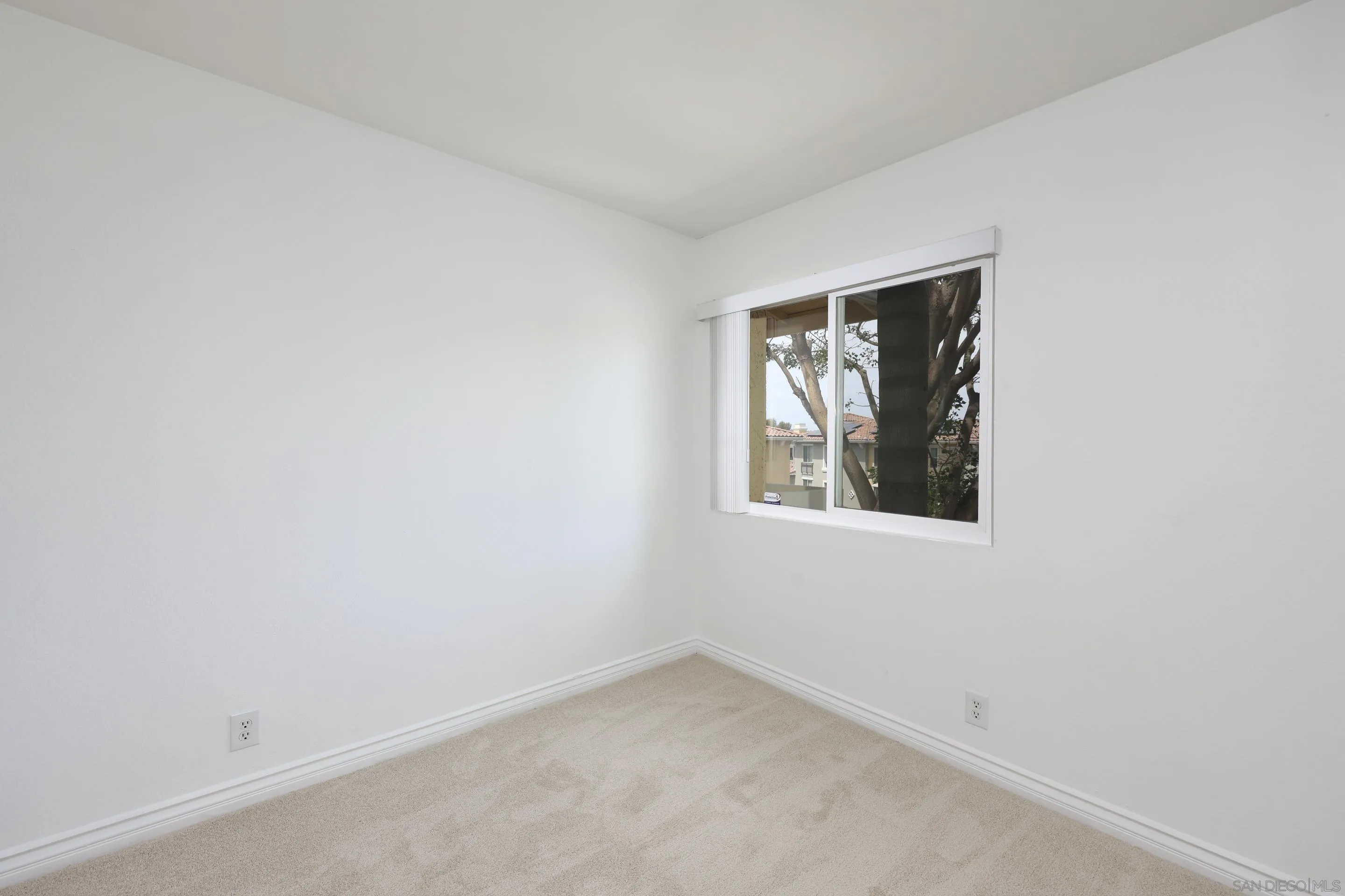 9949 Erma Road, Unit 203 San Diego, CA 92131 - Photo 30 of 43 an empty room with a window