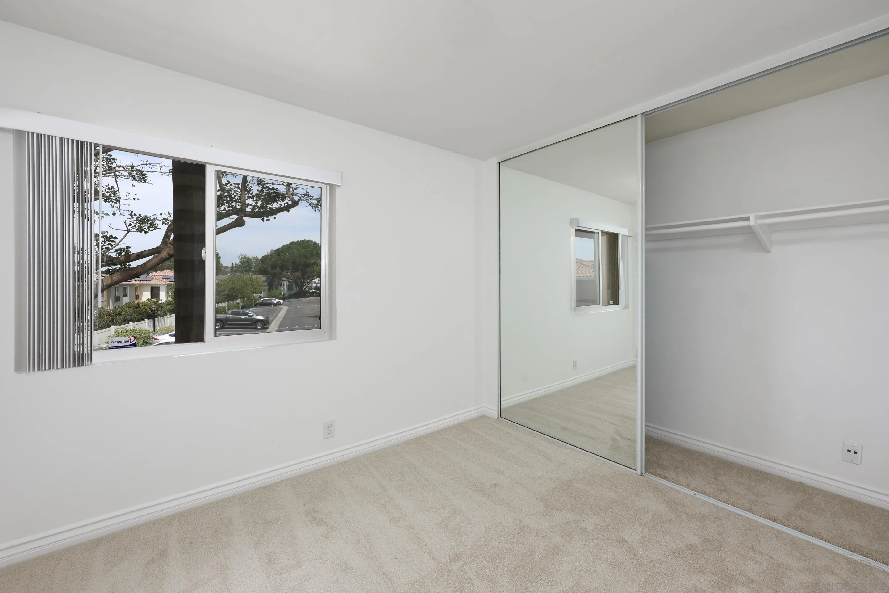 9949 Erma Road, Unit 203 San Diego, CA 92131 - Photo 31 of 43 an empty room with windows