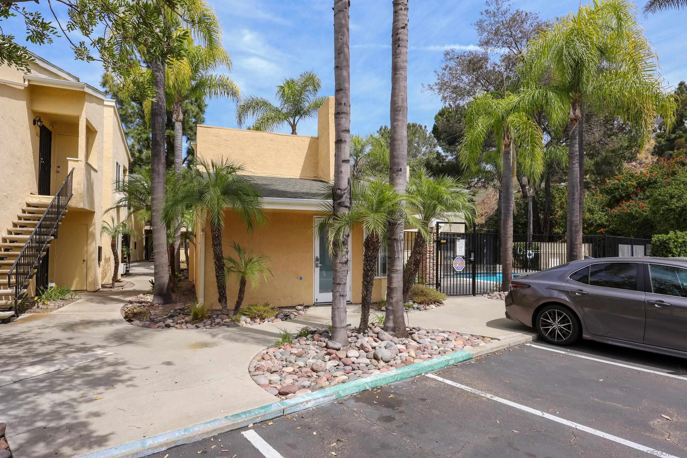 9949 Erma Road, Unit 203 San Diego, CA 92131 - Photo 39 of 43 a view of a car parked in front of a building