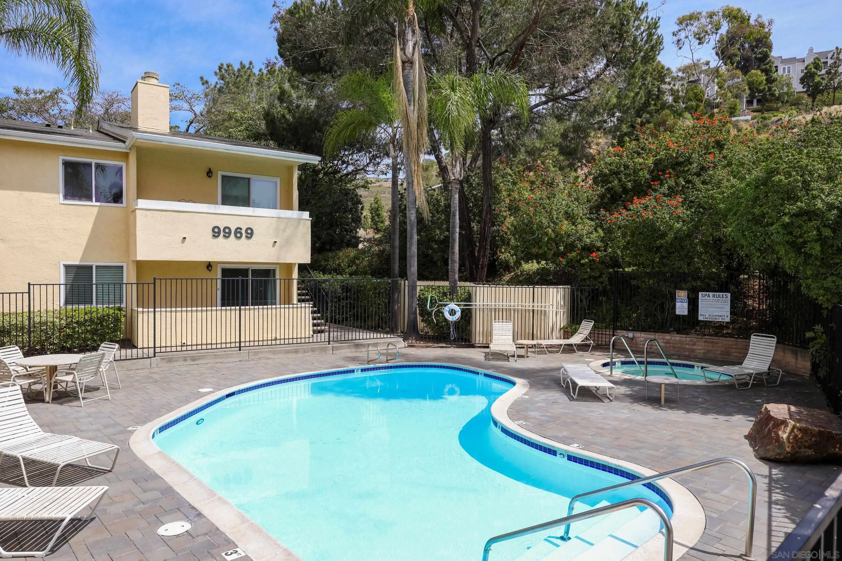 9949 Erma Road, Unit 203 San Diego, CA 92131 - Photo 41 of 43 a swimming pool with outdoor seating and yard