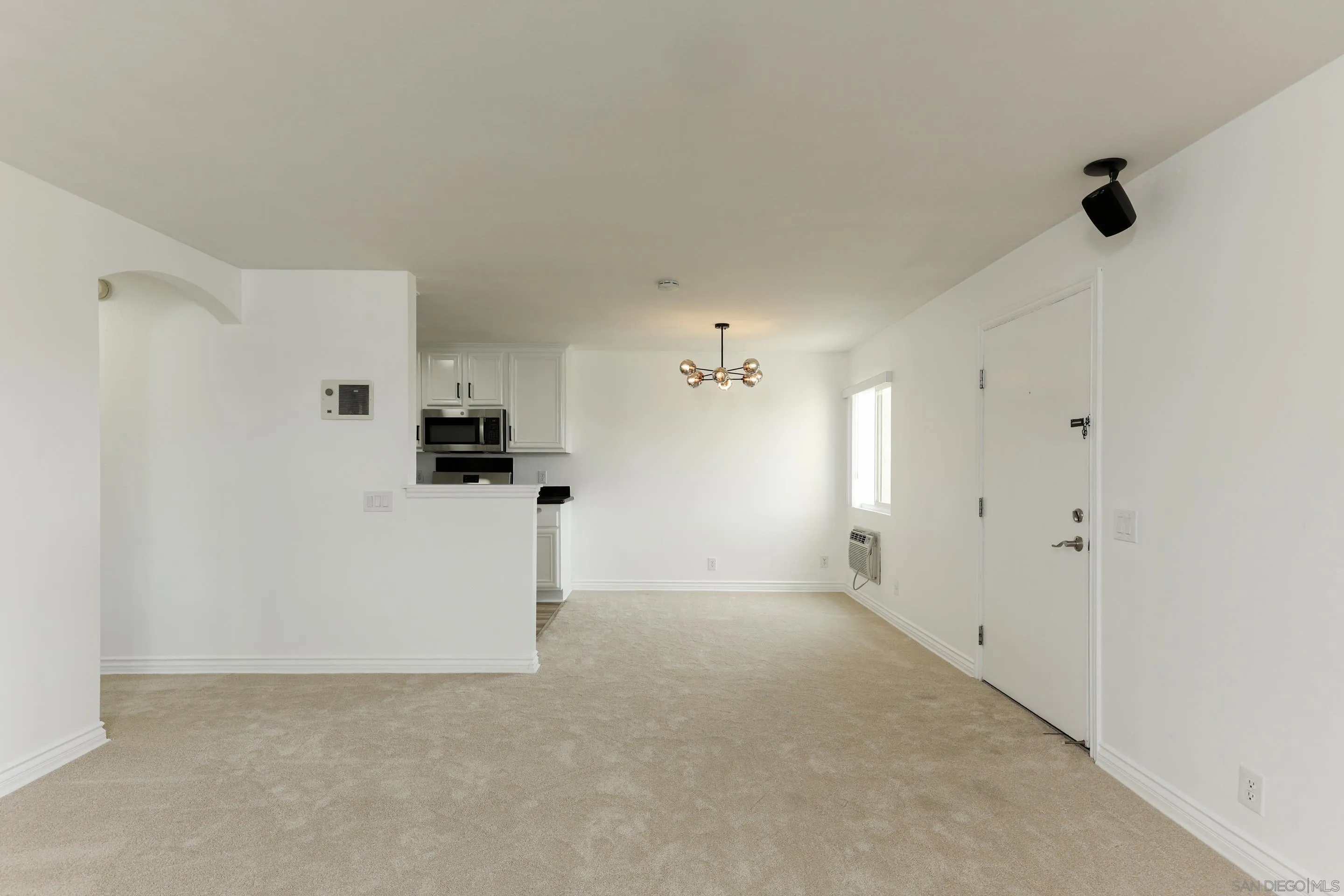 9949 Erma Road, Unit 203 San Diego, CA 92131 - Photo 9 of 43 a view of a big room with closet and windows