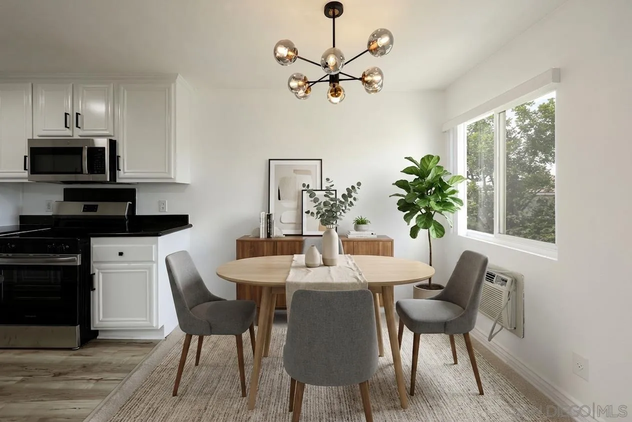 9949 Erma Road, Unit 203 San Diego, CA 92131 - Photo 10 of 43 a view of a dining room with furniture window and wooden floor