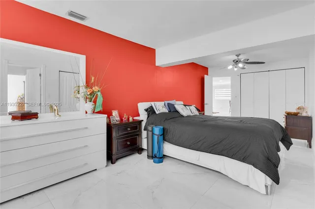 a bedroom with a bed and a dresser