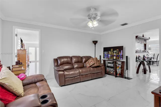 a living room with furniture and a view of living room