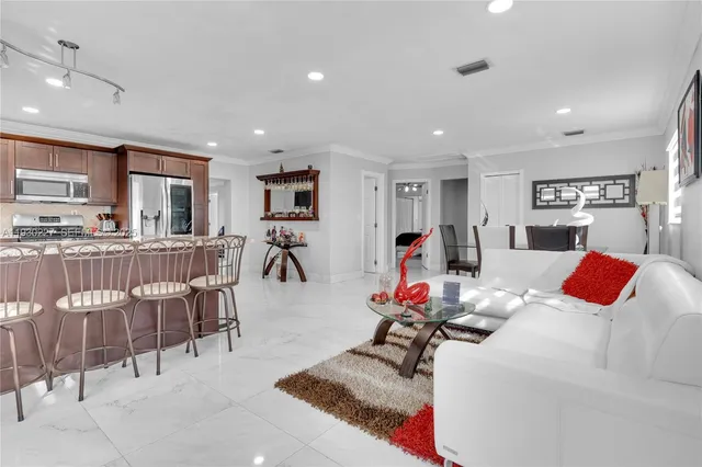 a bedroom with furniture and a flat screen tv