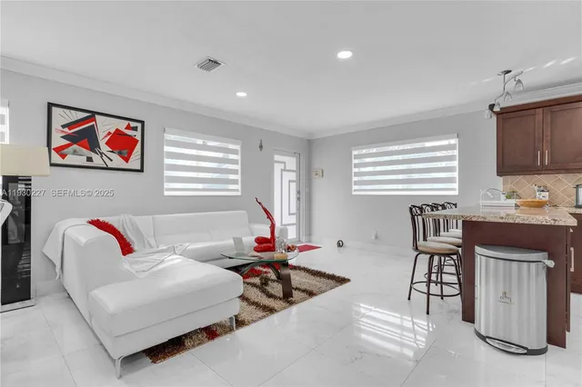 a living room with furniture and a window