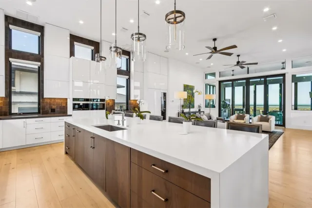 a bedroom with a large bed and a painting on the wall