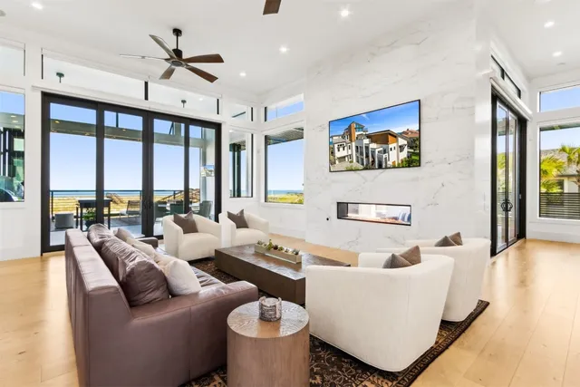 a balcony with furniture and a potted plant