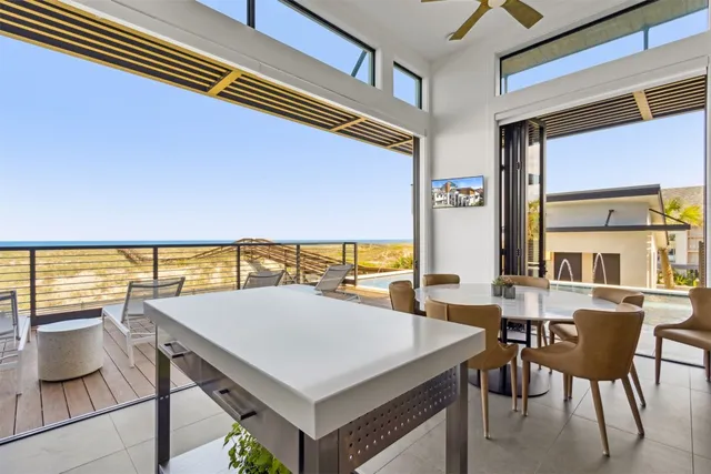 a view of swimming pool with outdoor seating