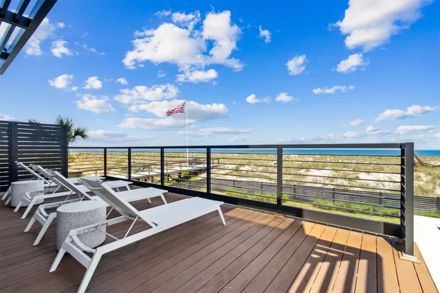 a balcony with couch and city view