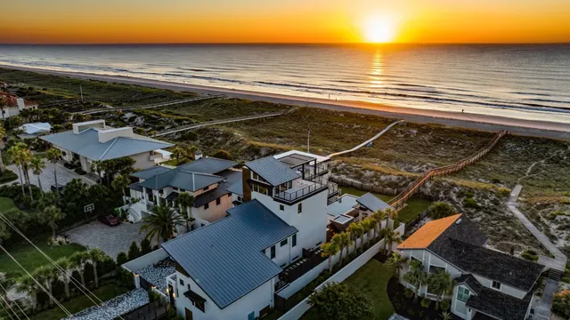 a view of a dining room with furniture and a large window