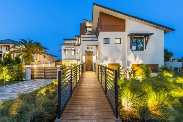 a living room with couches and painting on the wall