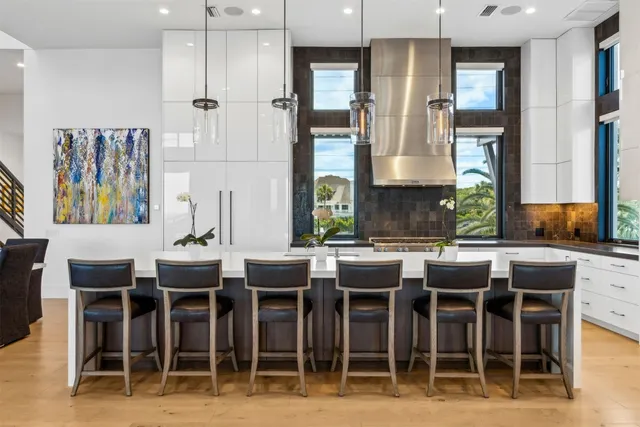 a bedroom with a bed and glass walk in closet