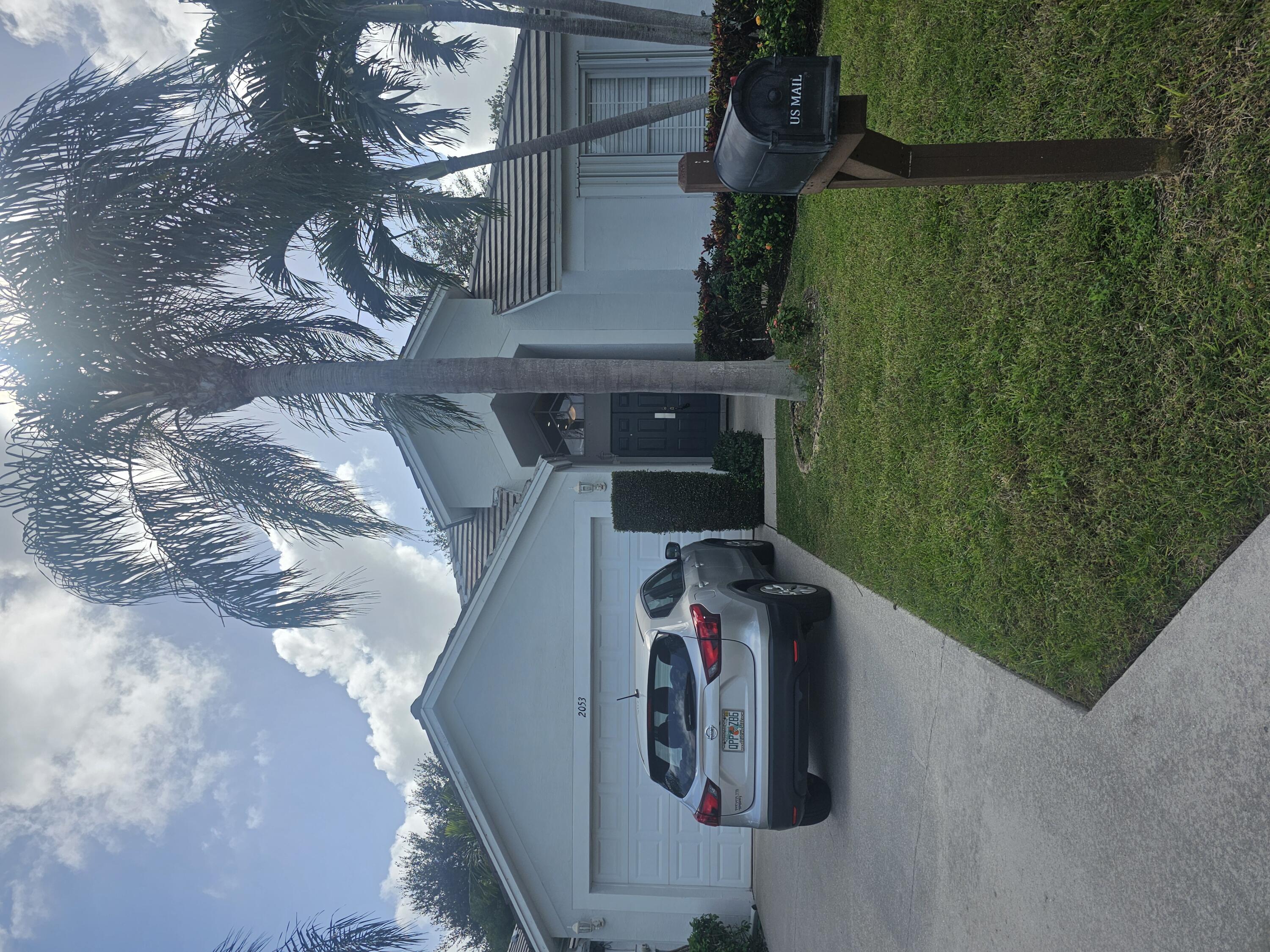 2053 Normandy Circle West Palm Beach, FL 33409 - Photo 1 of 21 Front