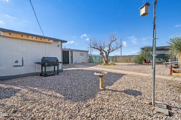 a view of a backyard of the house