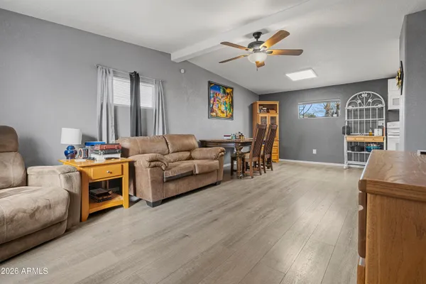a living room with furniture and a chandelier
