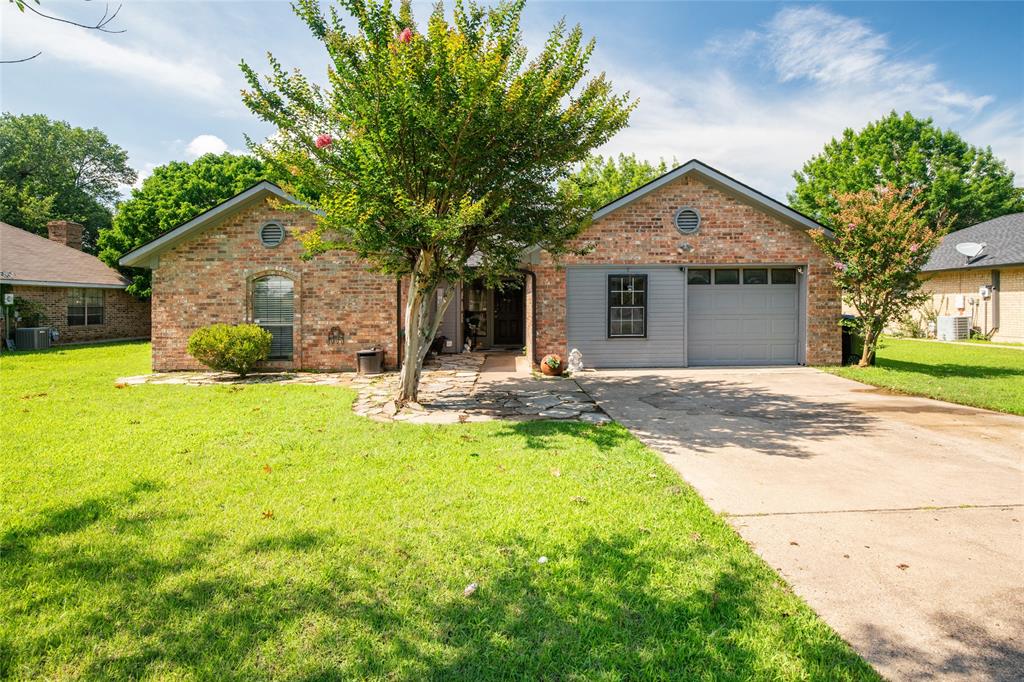 a view of a house with pool and a yard