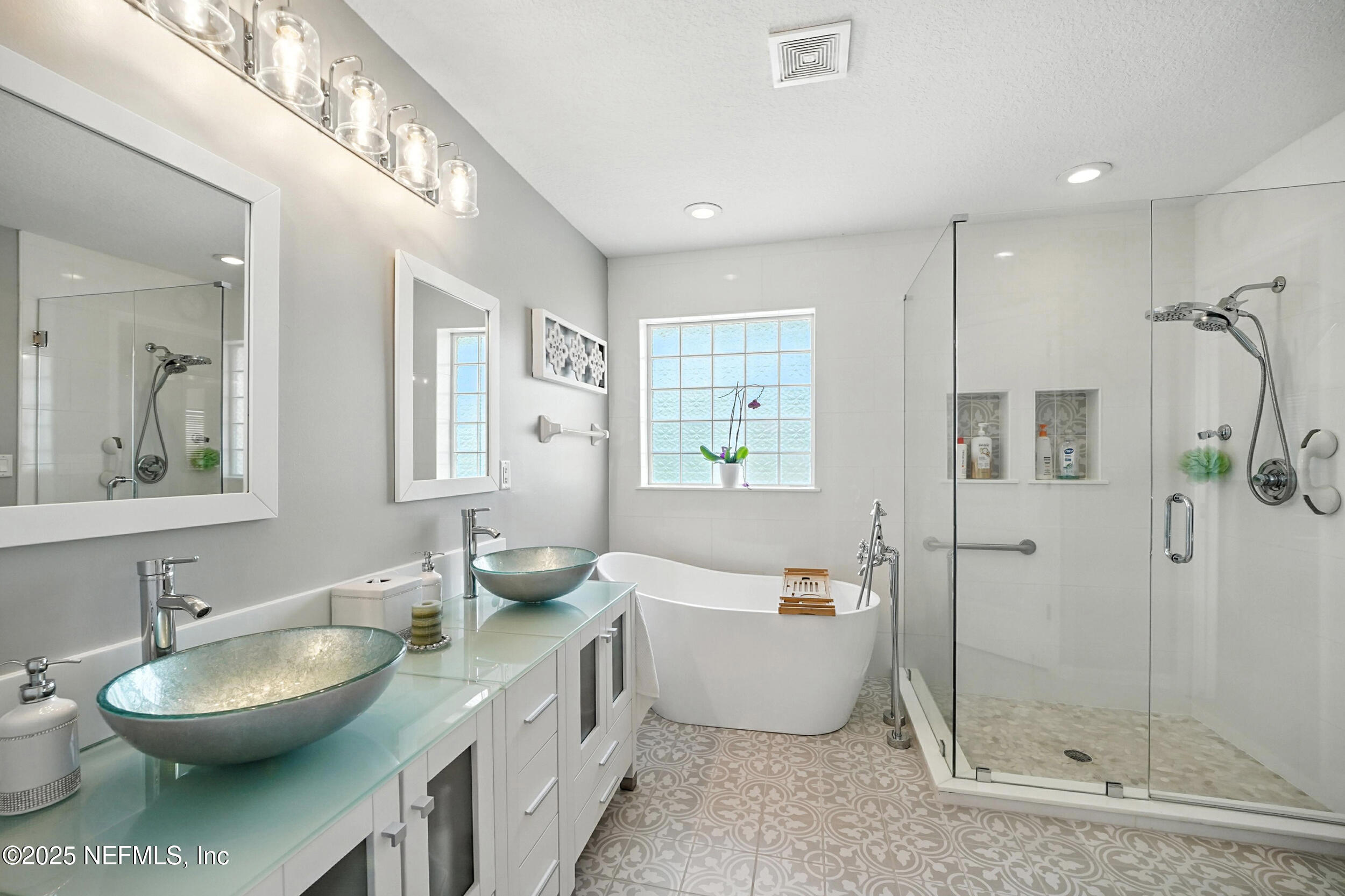 5877 Wind Cave Lane Jacksonville, FL 32258 - Photo 16 of 44 a spacious bathroom with a sink toilet and shower