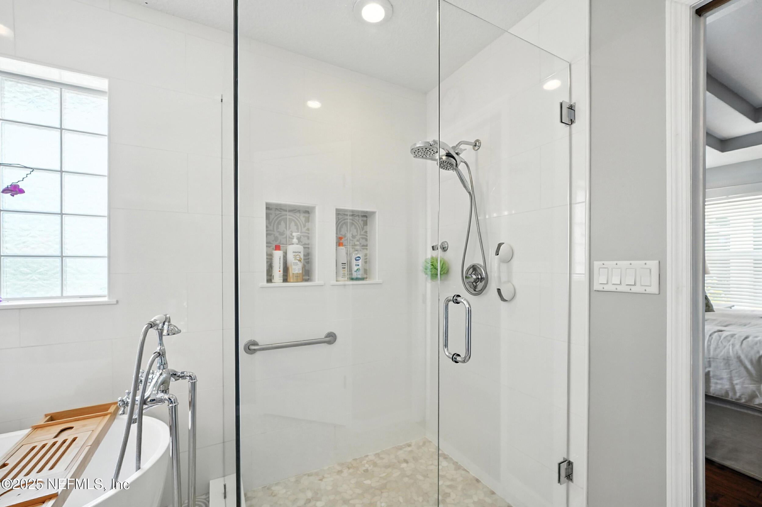 5877 Wind Cave Lane Jacksonville, FL 32258 - Photo 18 of 44 a bathroom with a shower