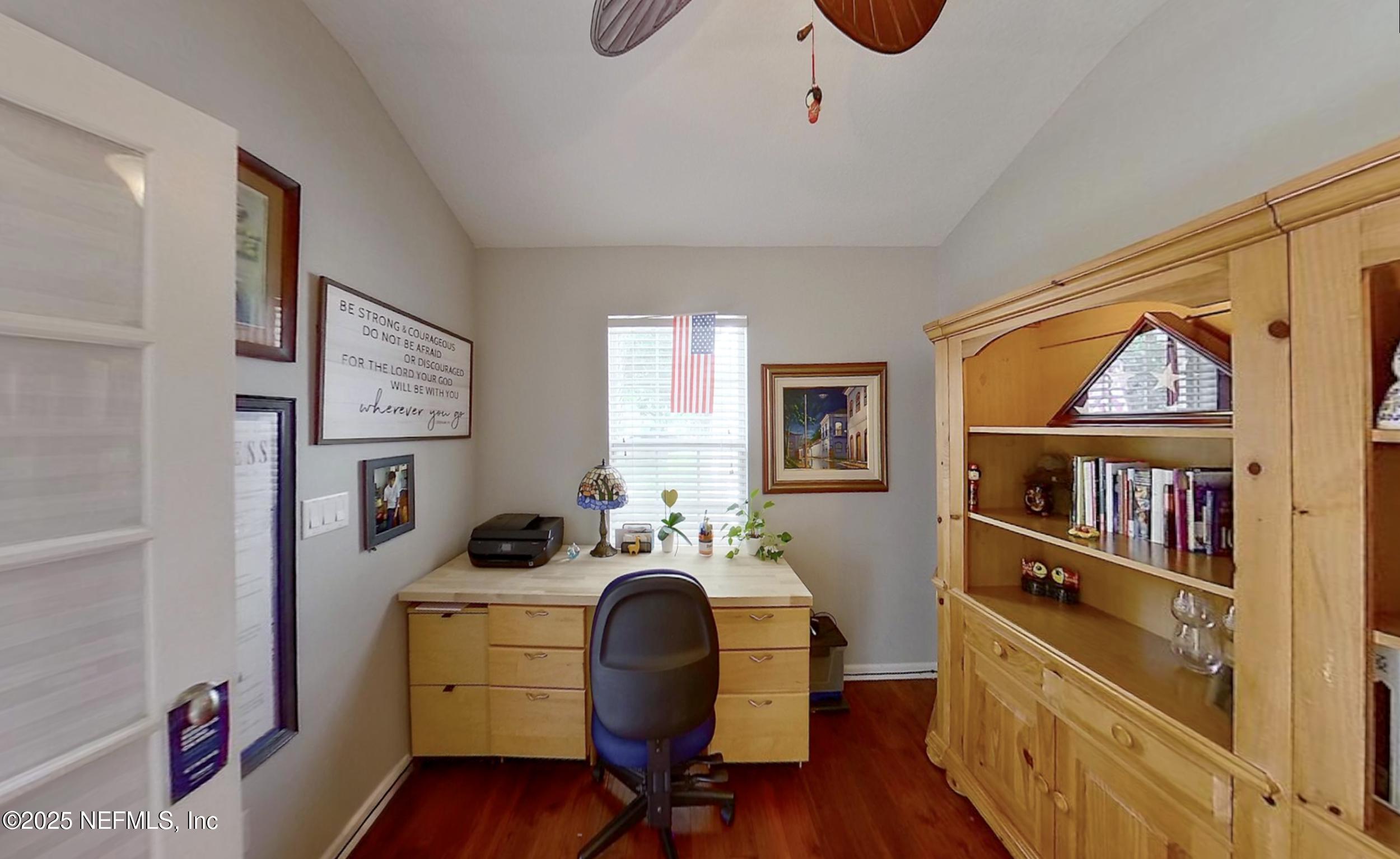 5877 Wind Cave Lane Jacksonville, FL 32258 - Photo 22 of 44 a view of a workspace with furniture and a window